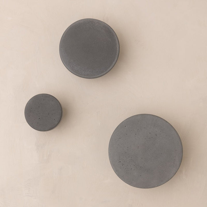 Round grey knobs made from concrete