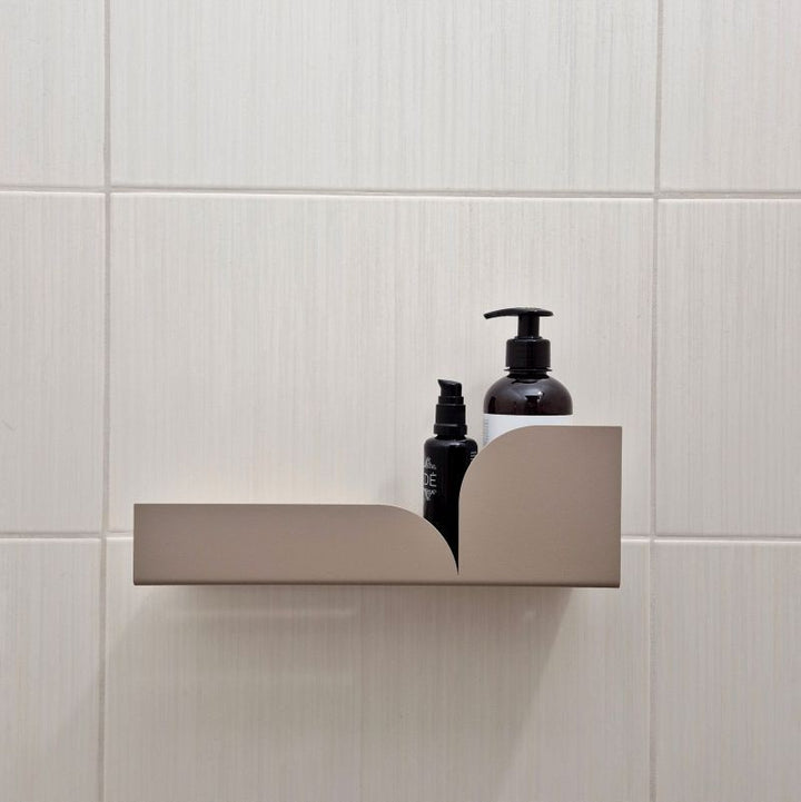 Beige metal shower shelf