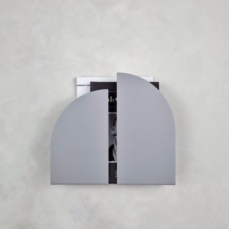 Grey metal wall mounted magazine rack