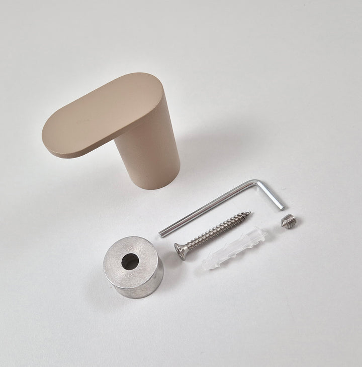 Minimalist wall hook parts including base, screw, and tools on a neutral background.
