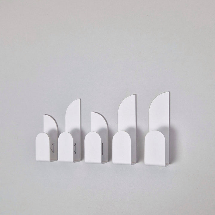 Adhesive wall hooks BAUHAUS in a minimalist design, perfect for home organization and stylish storage solutions.