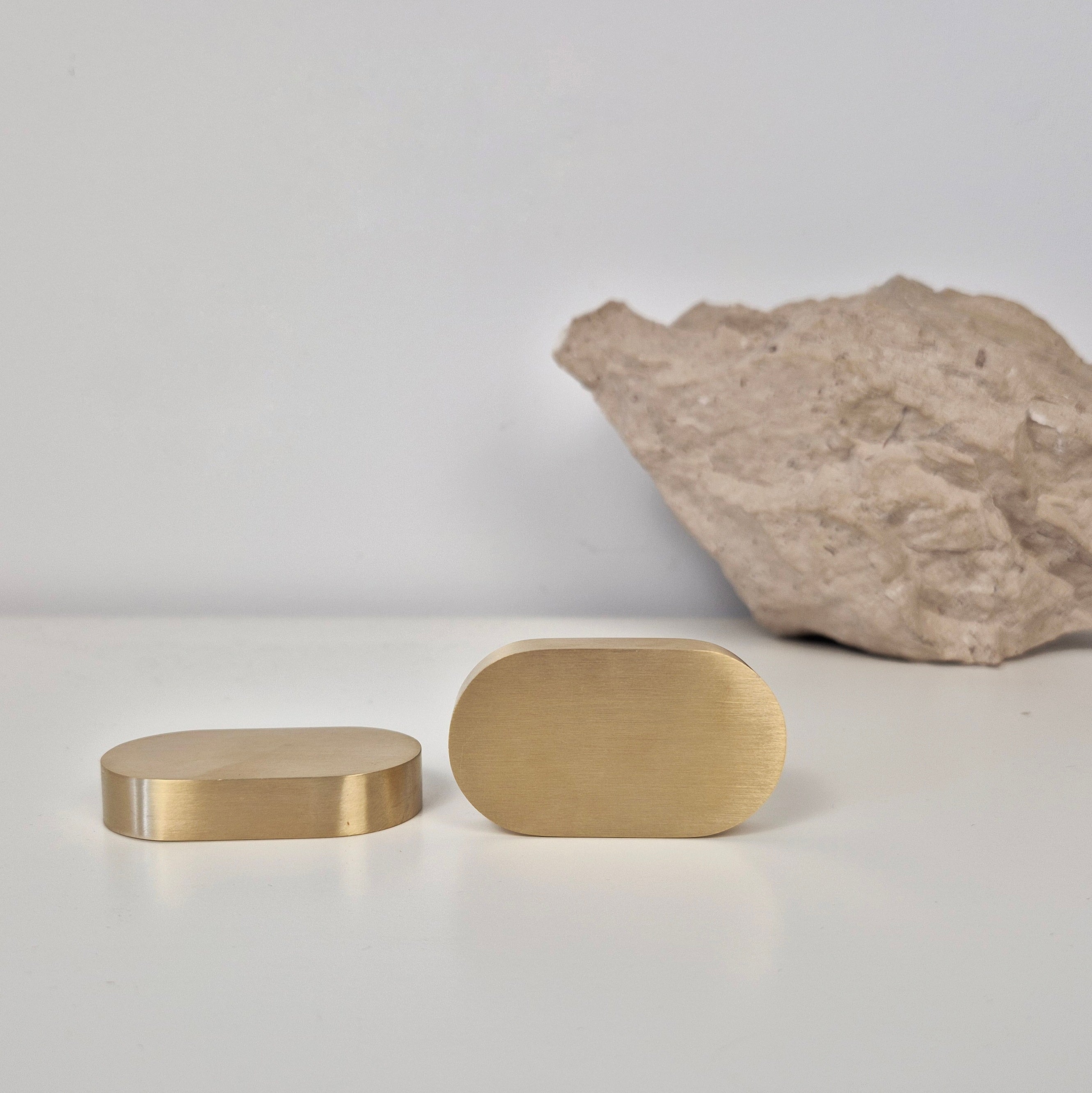 Brass cabinet pull DOME design showcasing solid brass finishes on a minimalist background.
