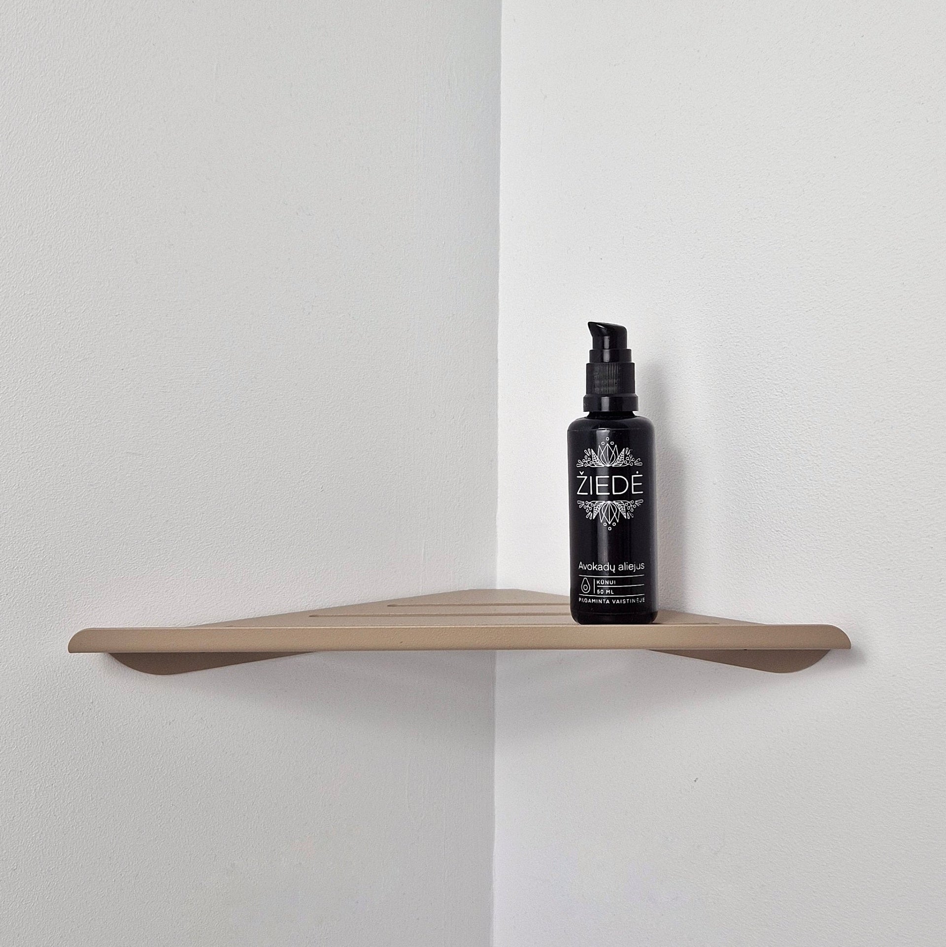 Beige shower corner shelf mounted in a tiled shower corner