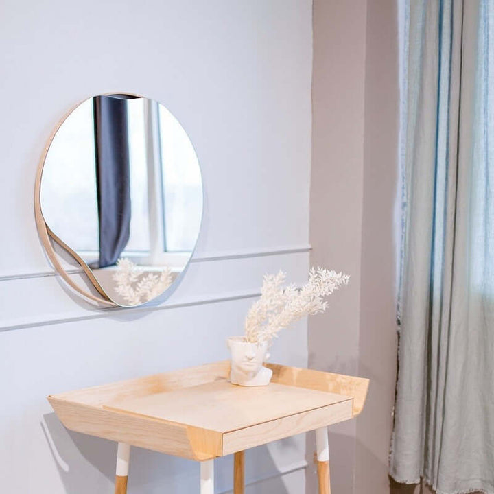 Asymmetric wooden mirror