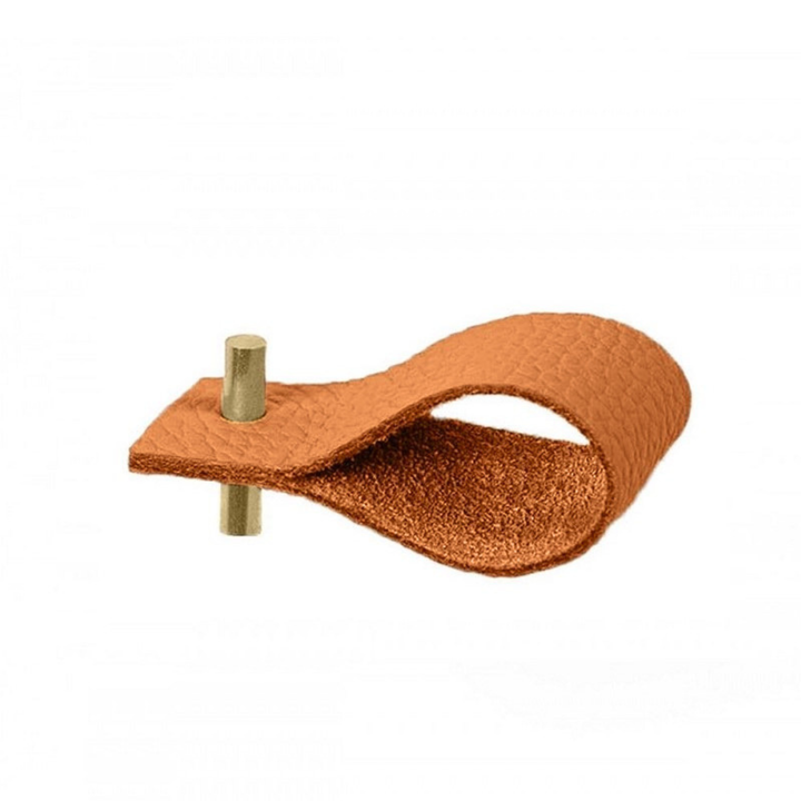 Leather napkin ring in mustard with brass accent, showcasing its elegant and minimalist design.