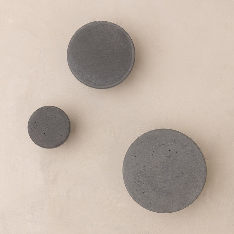 Round grey knobs made from concrete
