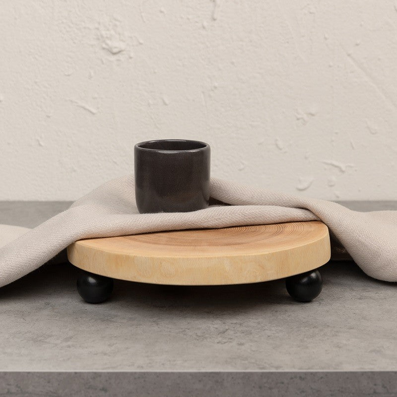 Round wooden tray with black details