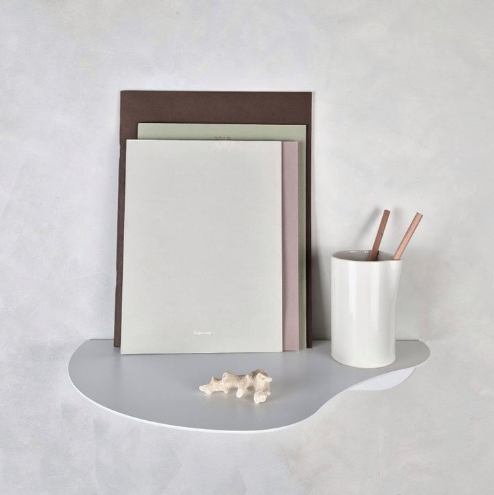 Small white wall mounted shelf